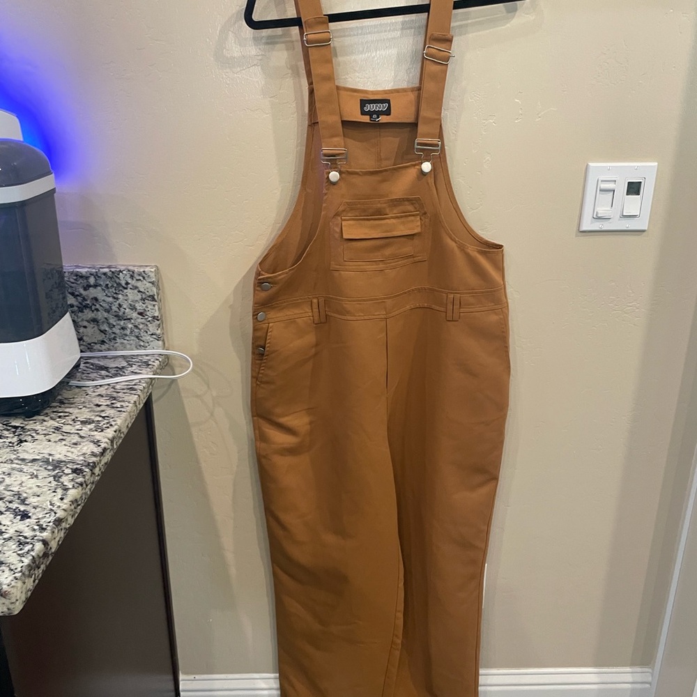 Tan Utility Jumpsuit with Adjustable Straps and Durable Fabric